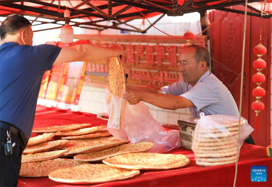 Técnicas tradicionais de fabricação de naan herdadas e desenvolvidas em Xinjiang