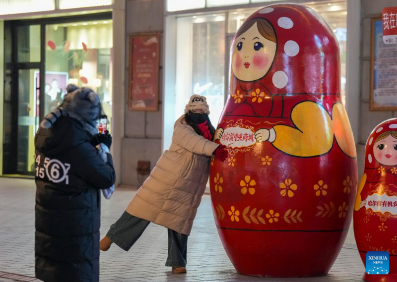 Galeria: Turistas visitam Rua Central em Harbin, no nordeste da China